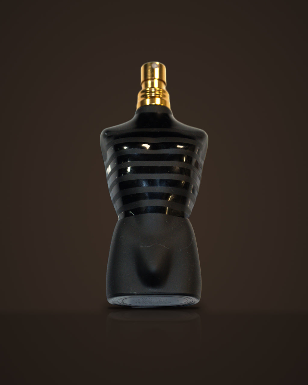 Le Male Elixir — Jean Paul Gaultier fragrance decant on dark background